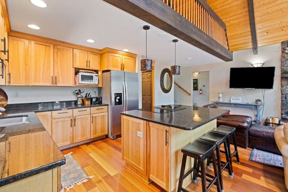 Fully equipped kitchen with island seating and plenty of prep space.