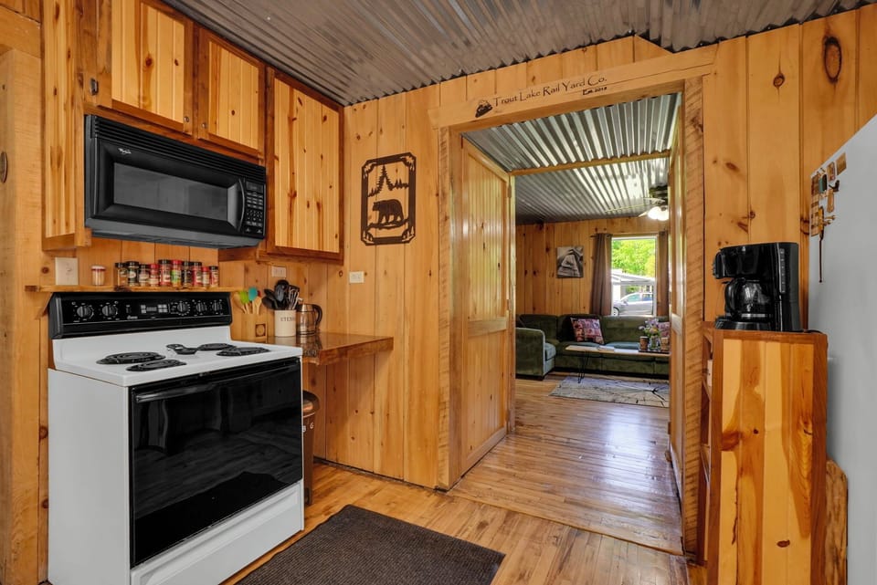 Kitchen with beautiful wooden cabinetry off the living room