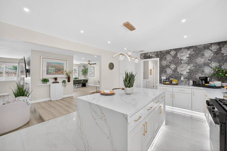 Spacious open-concept living area with premium marble island, ideal for cooking and gathering together.