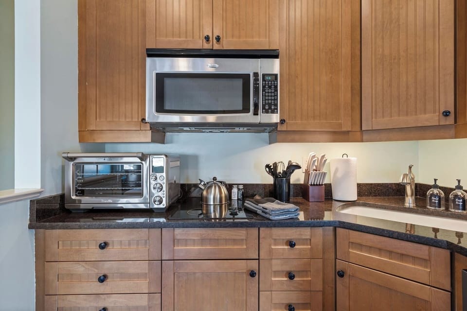 Full-size countertop Smart oven (holds a 13# turkey!) and stainless microwave — a proper kitchen in a perfectly sized space