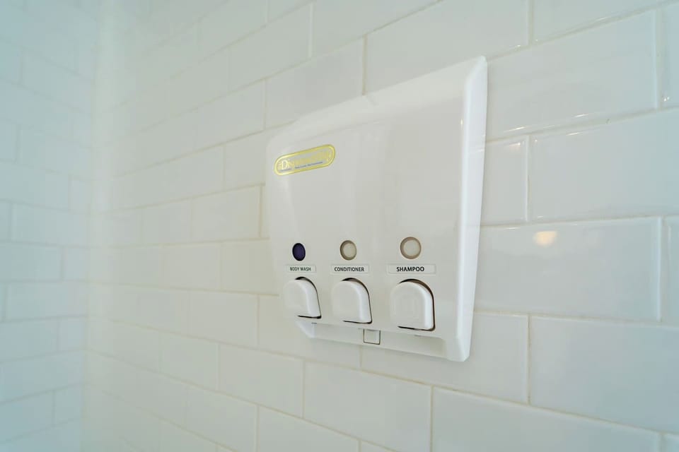 The Shower Gel, Shampoo, and Conditioner dispenser is there for your convenience. 
