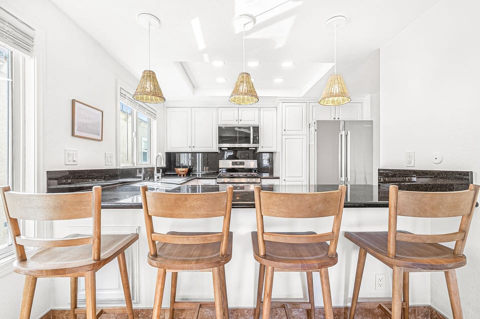 Kitchen counter seating provides the perfect spot for casual meals
                