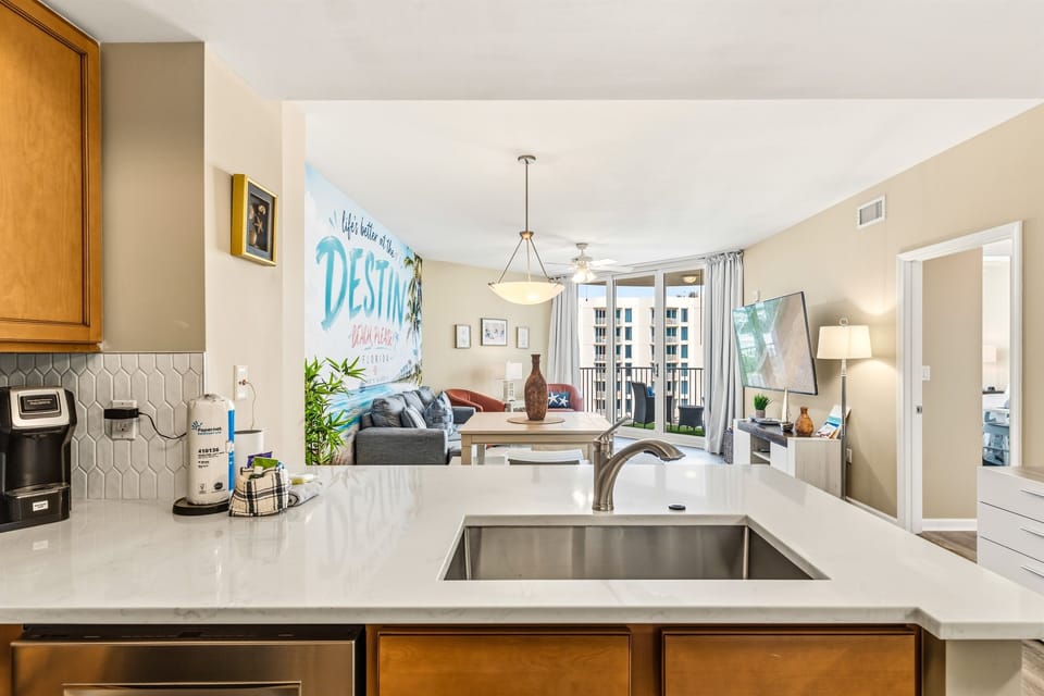 The white quartz countertops overlooking the family room