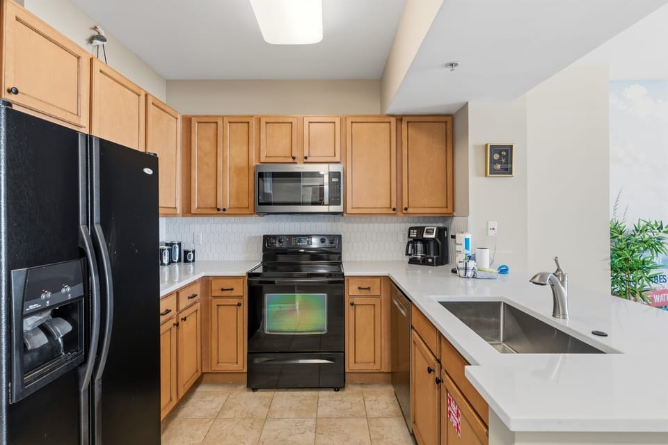 Fully equipped kitchen with white quartz countertops