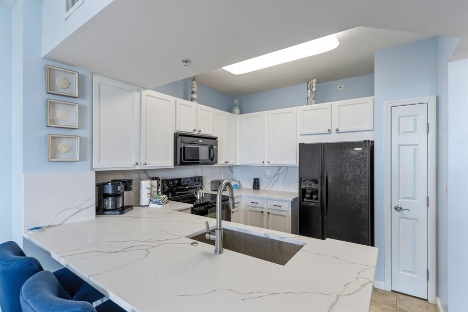 The kitchen has lots of counterspace and everything you need for planning meals
