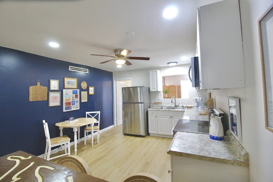 The fully stocked spacious kitchen offers everything you need to prep, cook and dine.