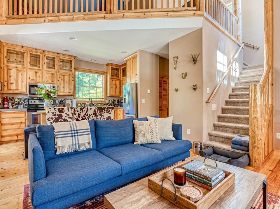 Living Room: Discover warmth in a spacious open layout with stylish furniture and natural light!