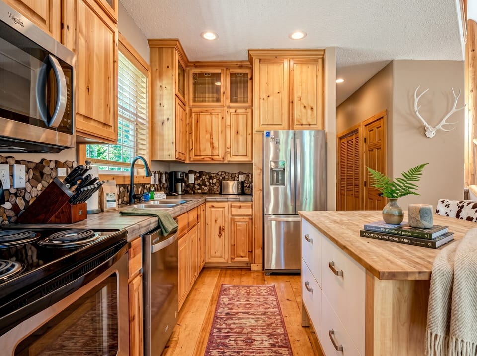 Kitchen: Enjoy culinary adventures in this bright, rustic kitchen with modern appliances & charm!