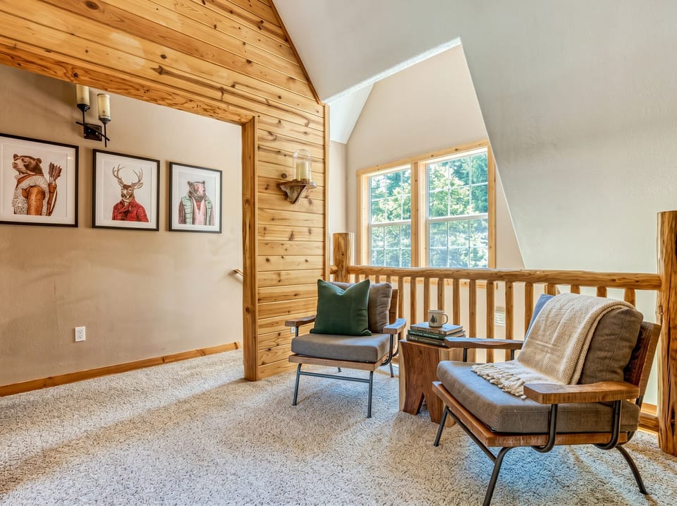 Loft Lounge: Relax in this charming space with scenic views and rustic artwork!