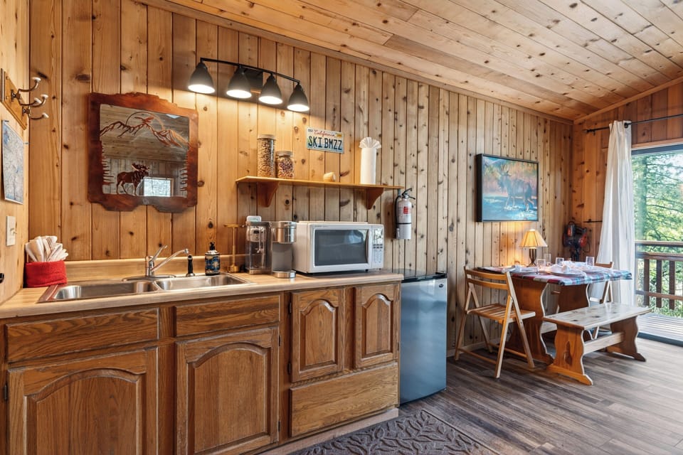 A built-in wet bar and kitchenette area on the lower level add convenience for guest entertaining.