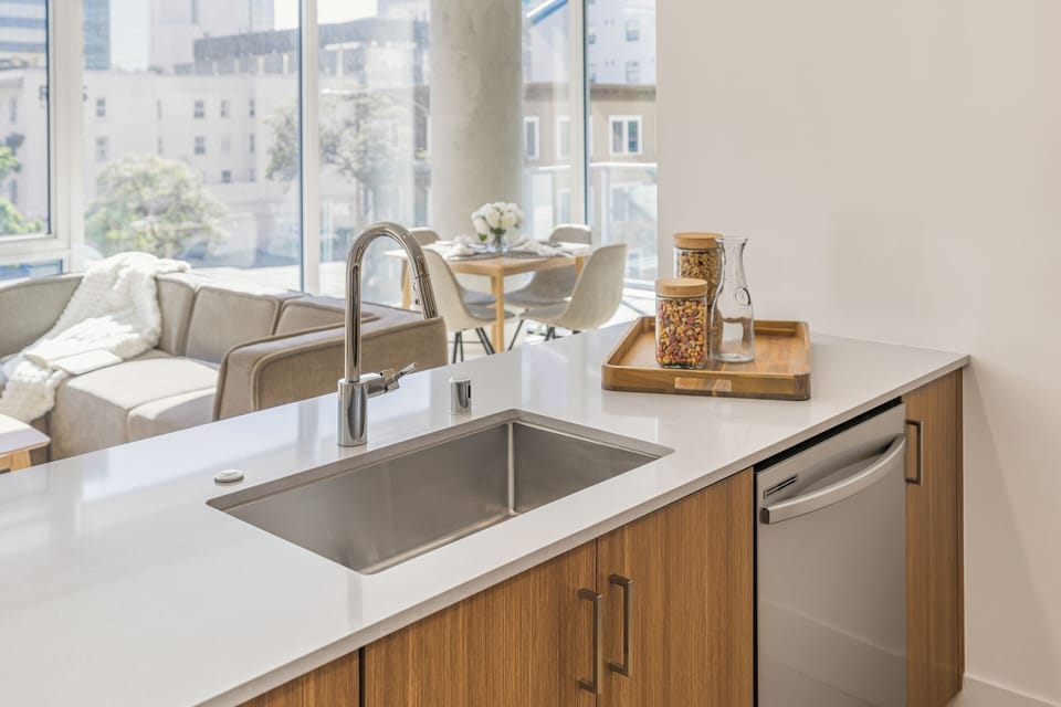 Unit 207: Kitchen stocked with essentials.