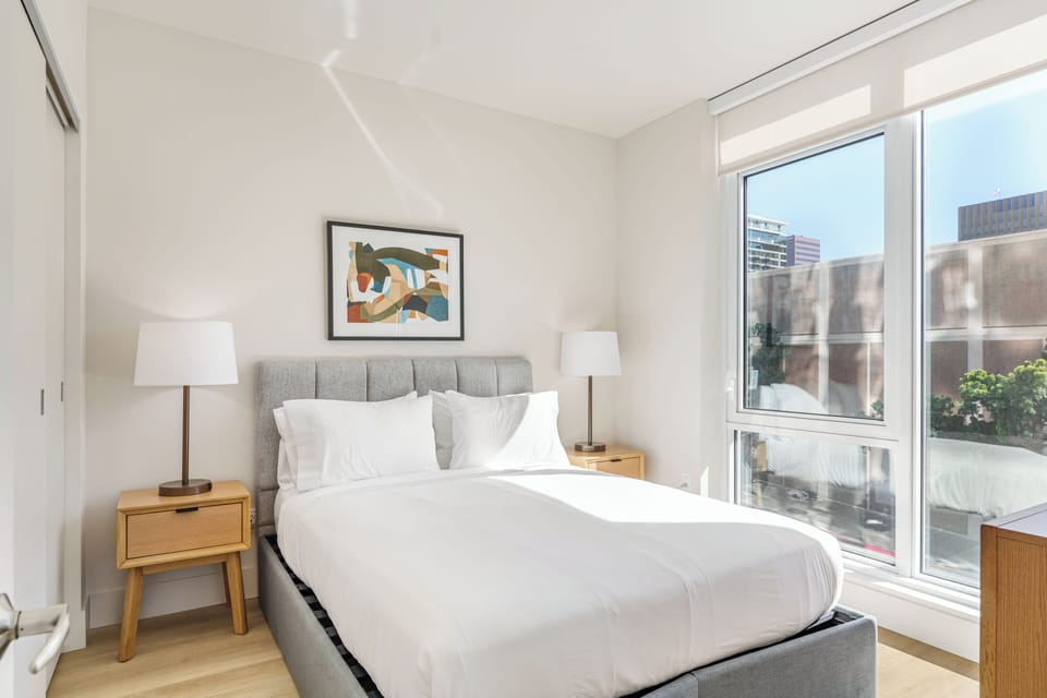 Unit 207: Bedroom 2 features a queen bed.