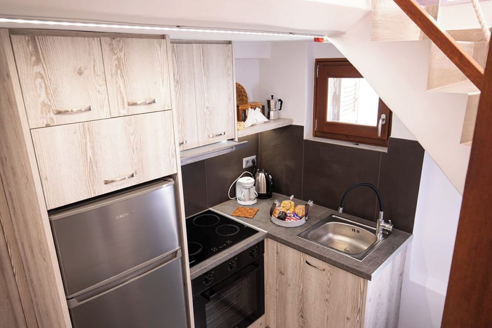 Apartment, Sea View | Private kitchen | Espresso maker, full-size fridge, oven, stovetop