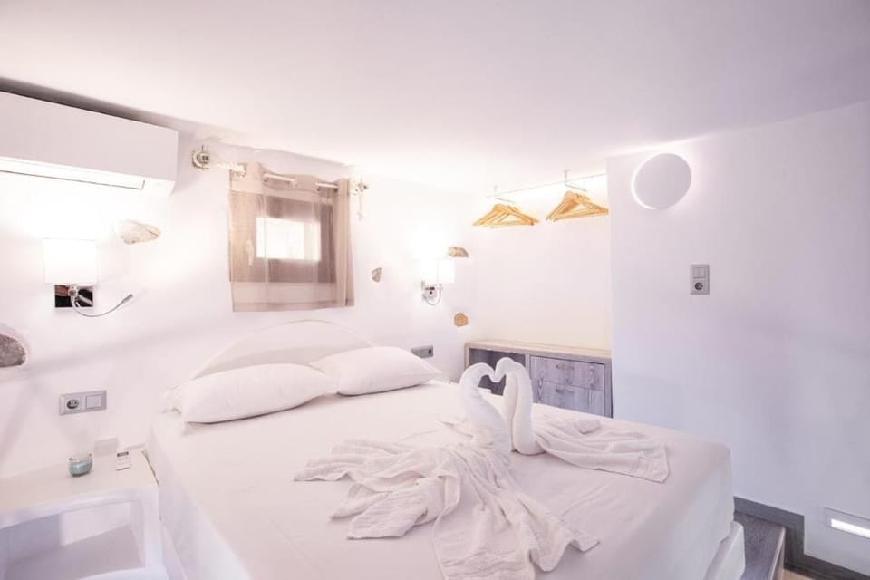 Apartment, Sea View | Pillowtop beds, in-room safe, soundproofing, iron/ironing board