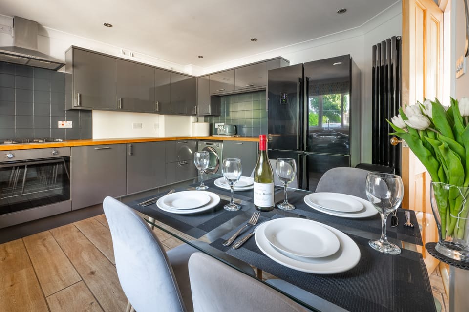 Ground floor: Kitchen with an electric oven and hob, microwave, dishwasher, large fridge/freezer and dining table with seating for four guests