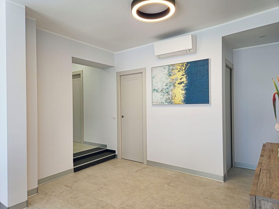 Interior Design, Flooring, Ceiling, Wood, Floor, Lighting, Light Fixture, Room, Molding, Wood Flooring