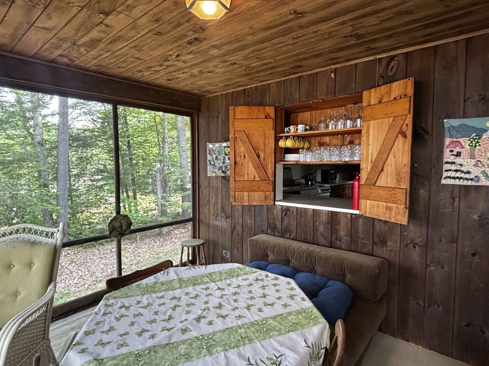 West Cove Cottage Screened In Porch with access into the kitchen
