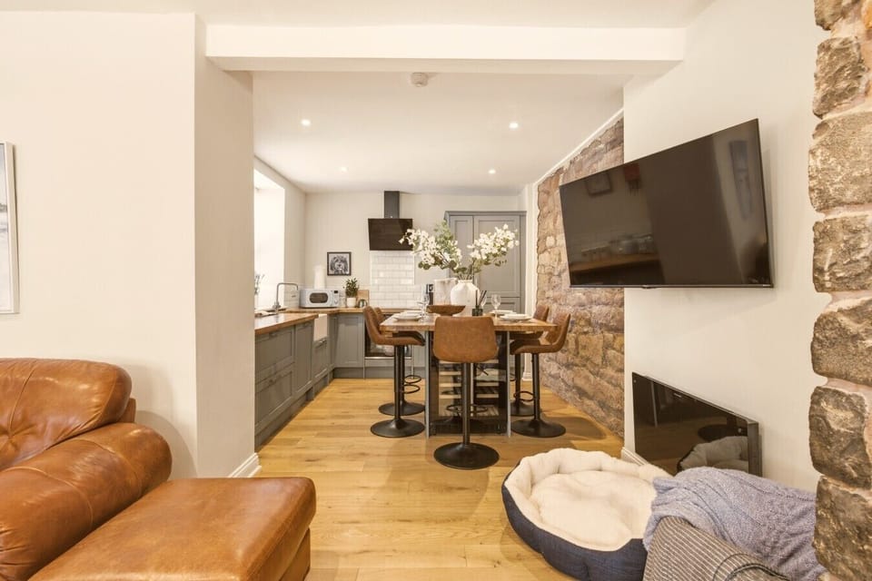 View from the lounge into the kitchen with breakfast bar seating.