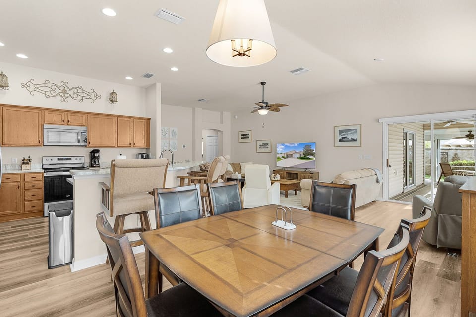 Gather around your spacious dining table that flows into the fully equipped kitchen and bright living room—perfect for shared meals and making memories together.