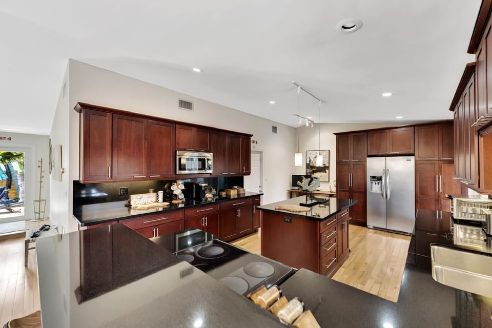 Spacious gourmet kitchen with granite counters & stainless appliances