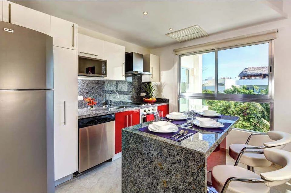 Open kitchen and living area with balcony