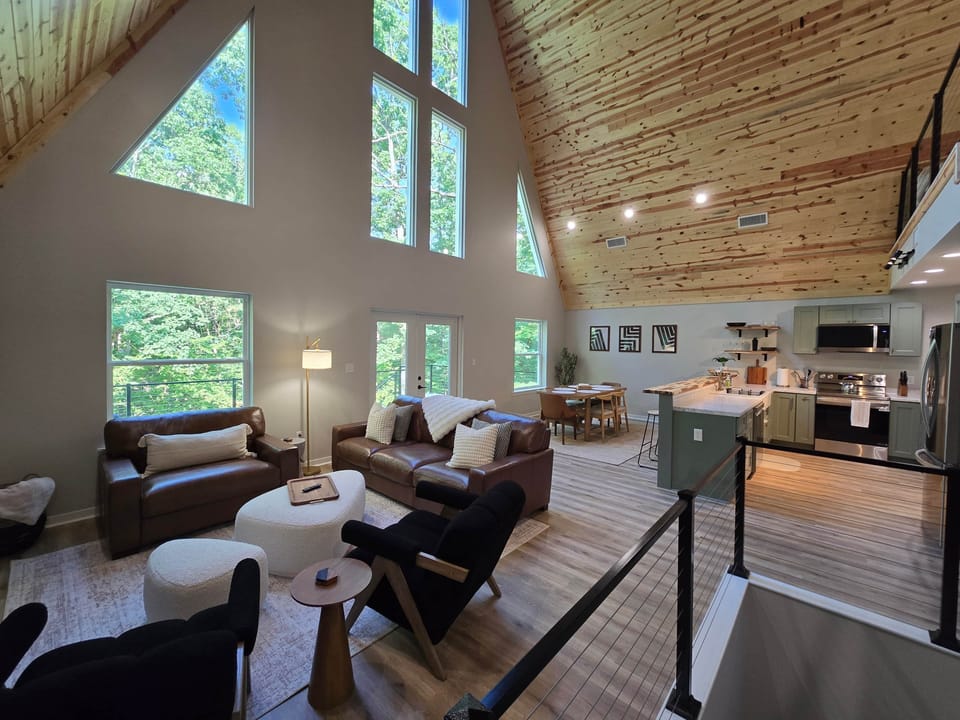 Soaring ceilings, massive windows, and cozy gathering spaces filled with natural light.