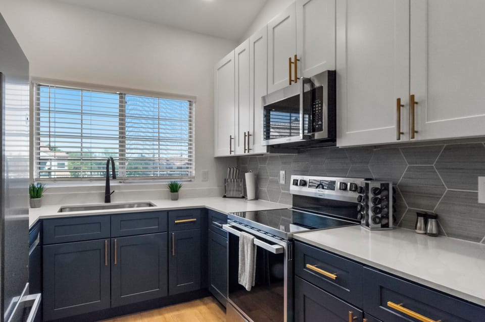 Fully equipped kitchen with a stove, oven, microwave, a full-size fridge.  