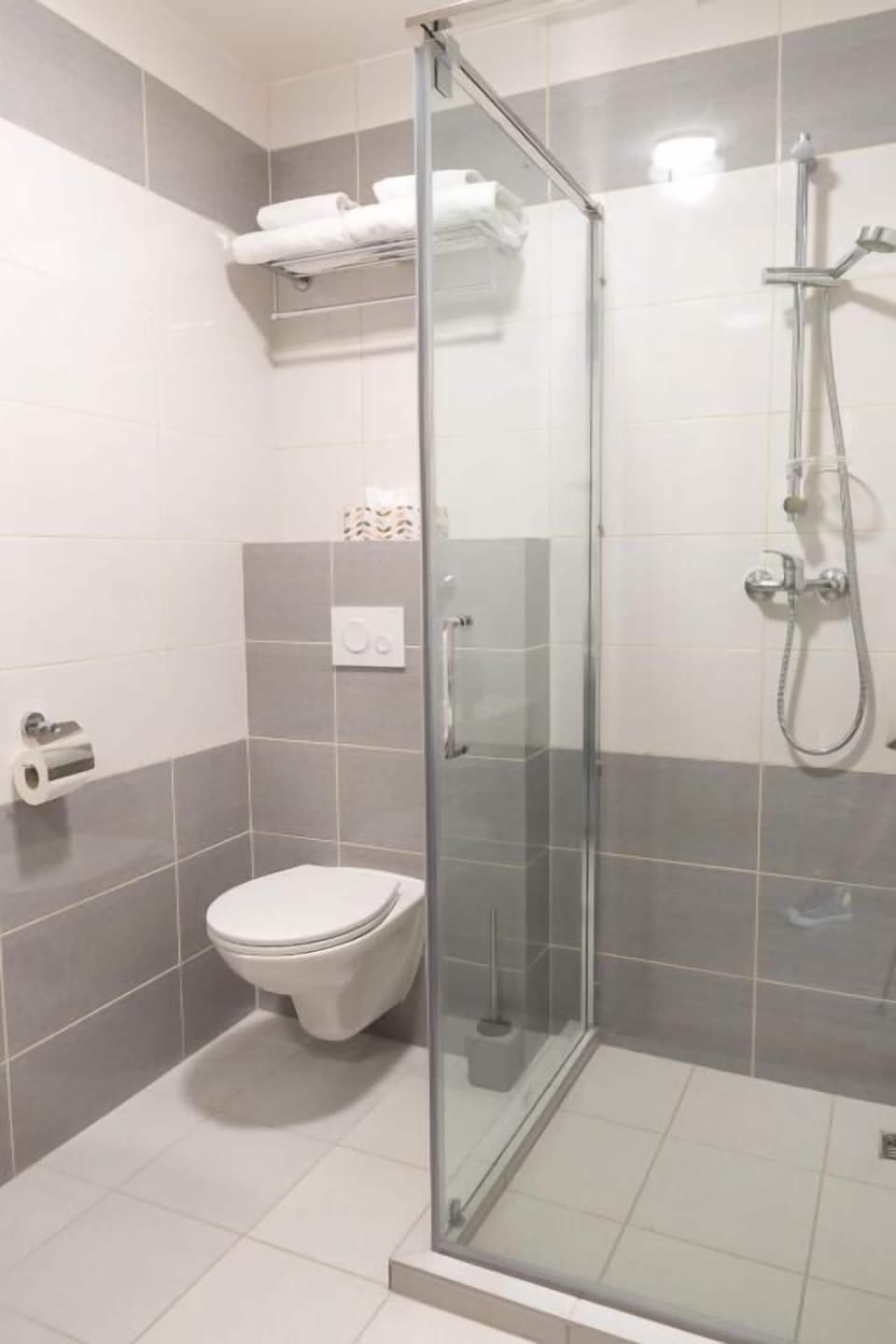 Shower, free toiletries, towels, toilet paper