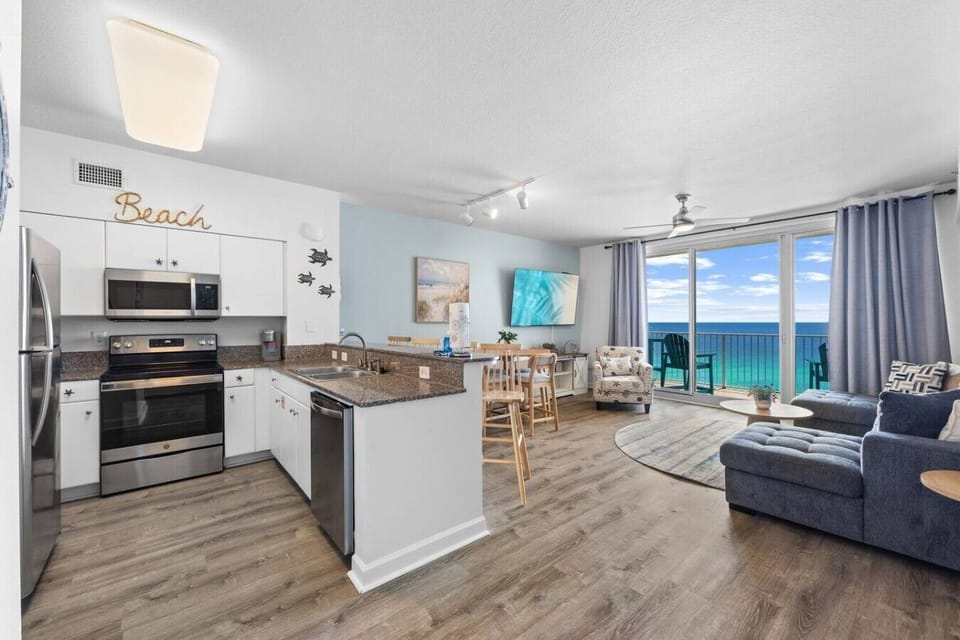 Enjoy cooking, dining, and relaxing in this open-concept living space with stunning beachfront views at Shores of Panama.