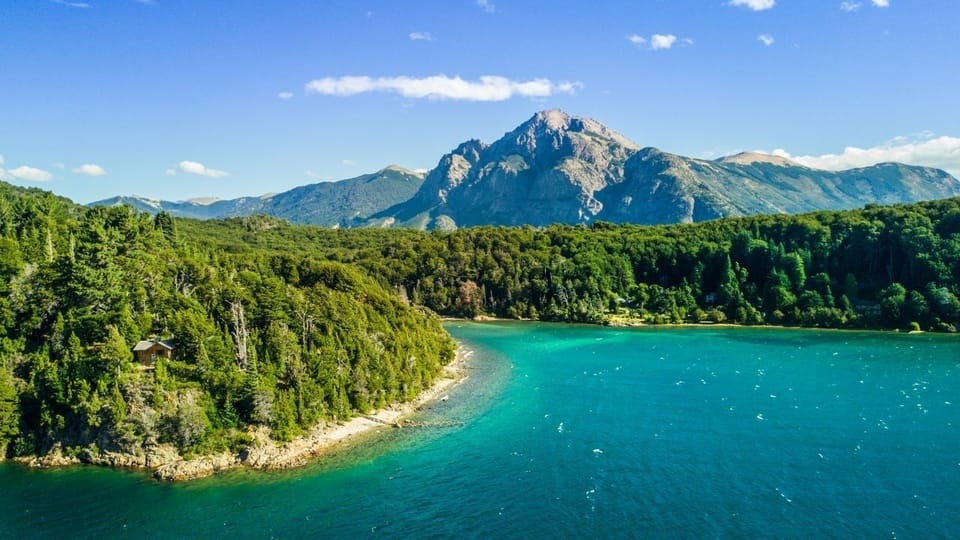 Breathe deep as turquoise waters meet dramatic mountain peaks.