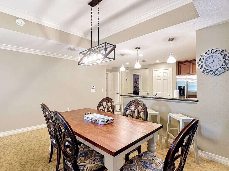 Elegant dining area with seating for six, conveniently connected to the fully equipped kitchen.