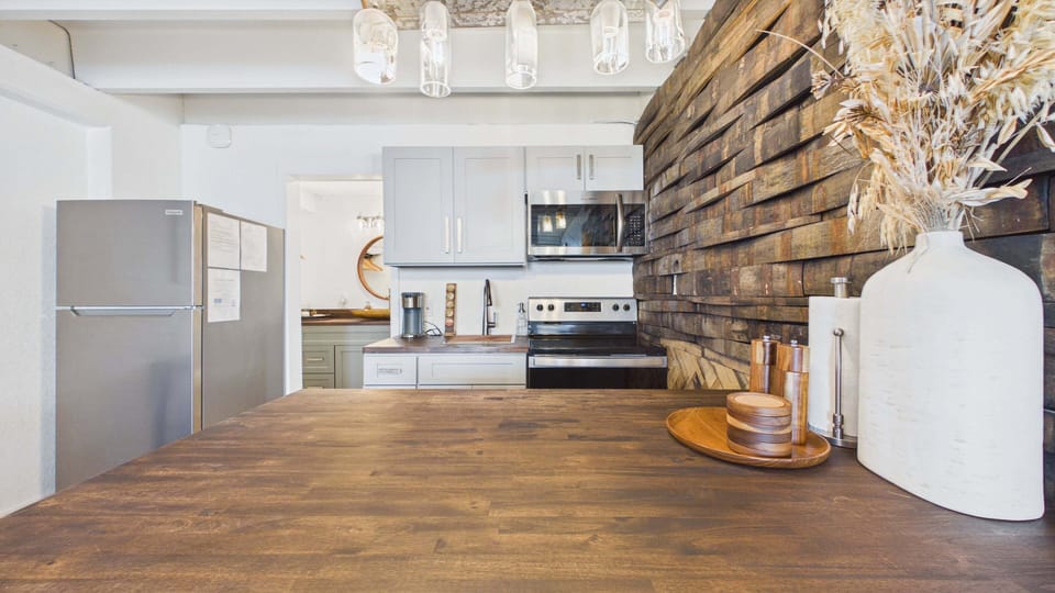 Full kitchen with bar stool seating on counter with all the cooking essentials. Fully updated as well.