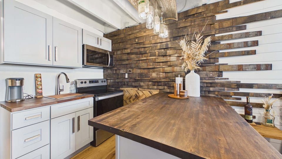 Full kitchen with bar stool seating on counter with all the cooking essentials. Fully updated as well.