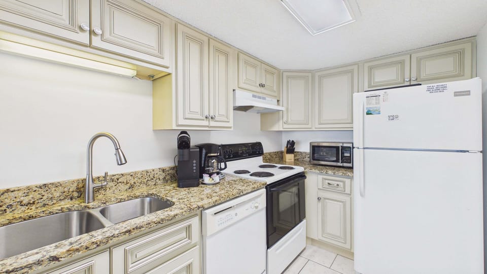 Full kitchen with all the cooking essentials and ample counter counter space for your culinary needs