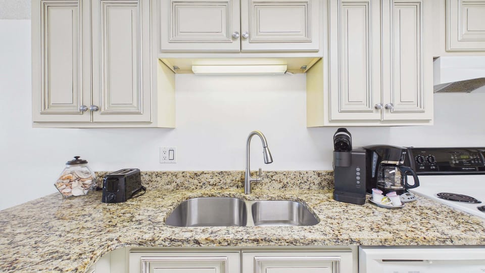 Full kitchen with all the cooking essentials and ample counter counter space for your culinary needs