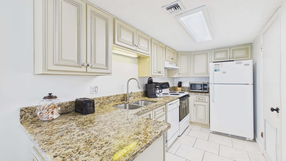 Full kitchen with all the cooking essentials and ample counter counter space for your culinary needs