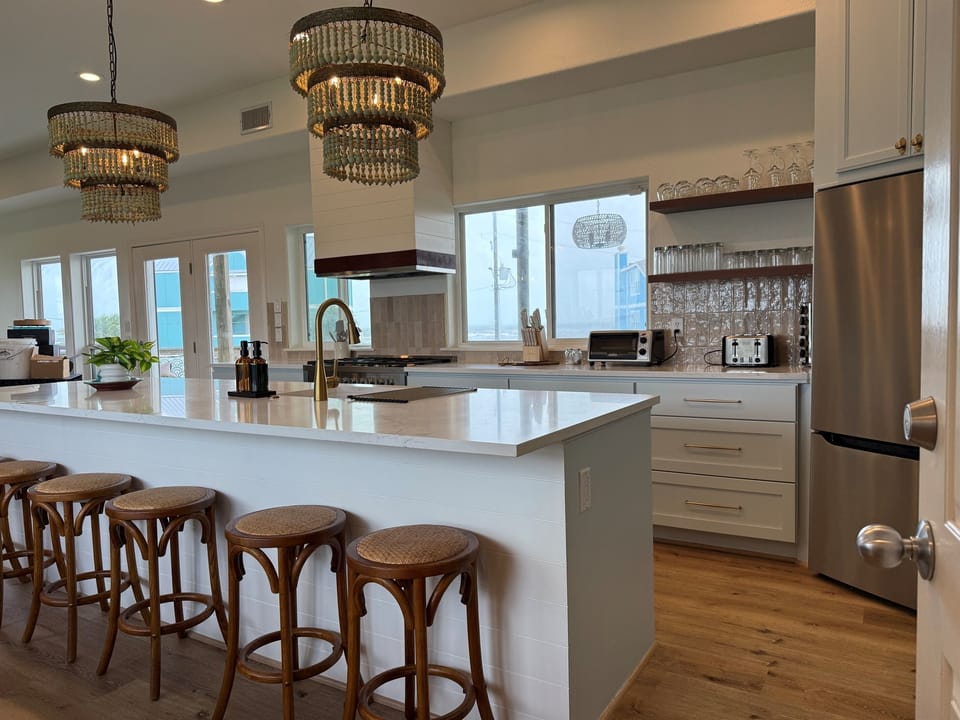 Welcome to the Sunrise Sunset Retreat! Best loaded beach house on the Island! Only Roof Top Bar in a Vacation Rental!