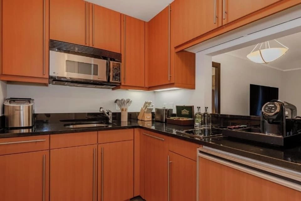 Modern kitchen with ample counter space, perfect for extended stays and home-cooked meals.