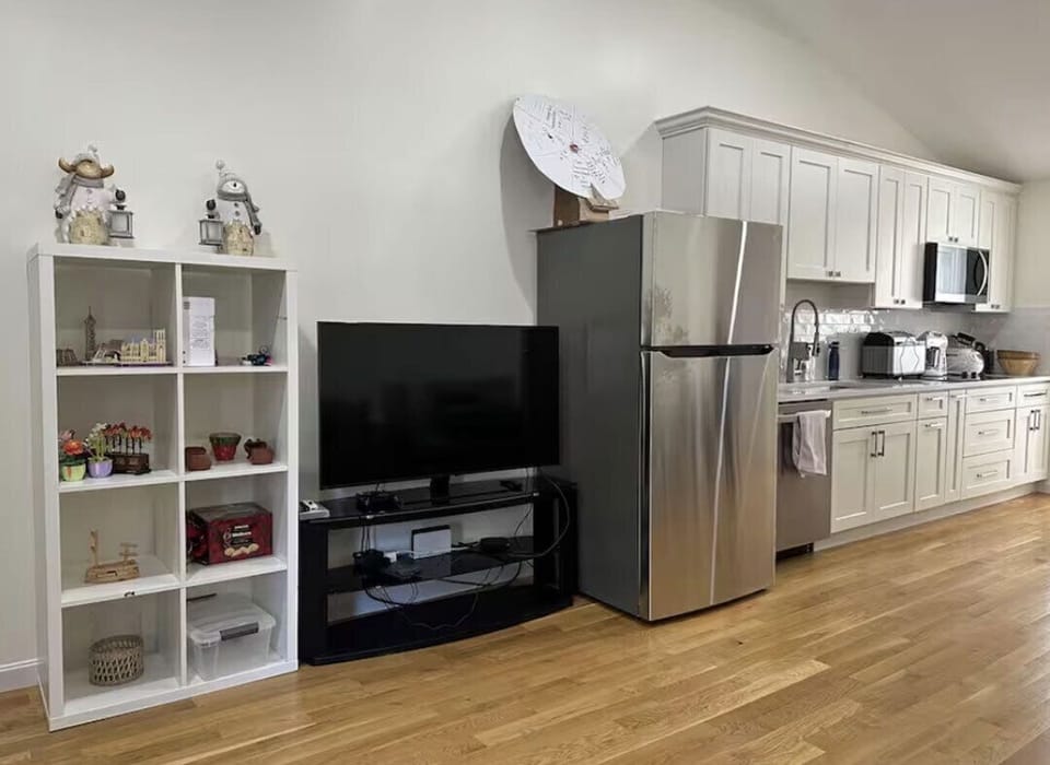 Kitchen and living space with TV