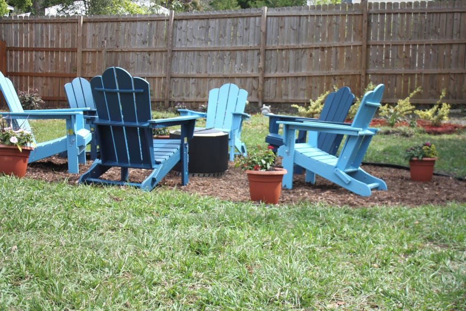 Yard with fire pit and sack toss “corn hole”