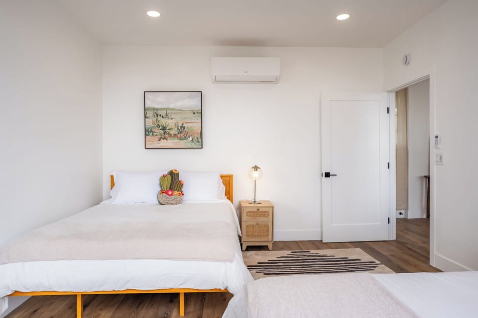 Sunlit view facing the windows—bright, airy, & comfortable for guests.