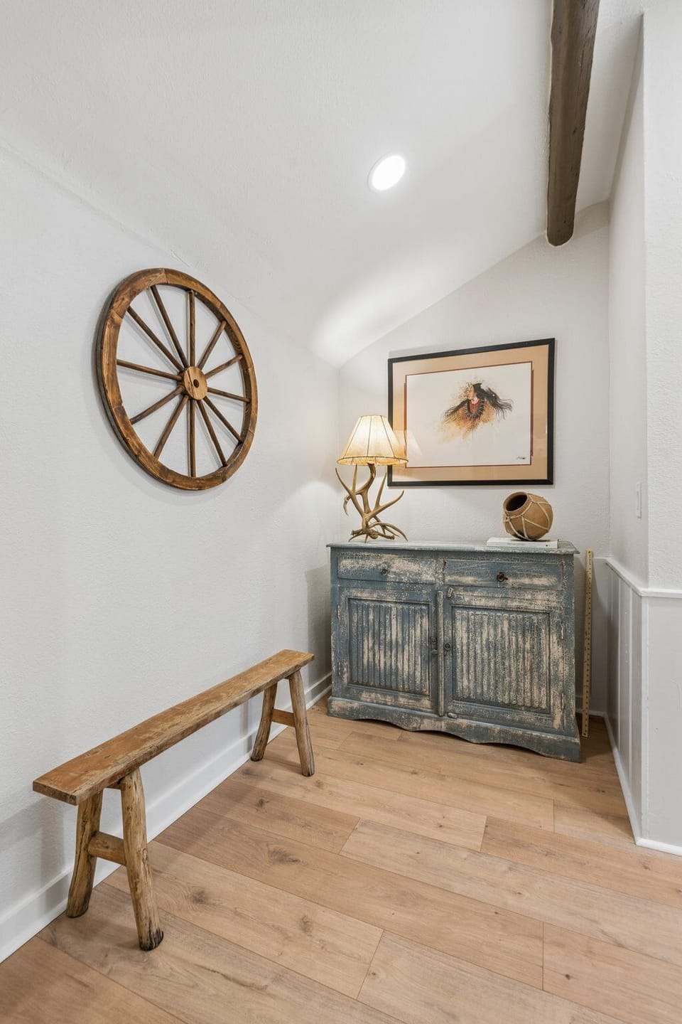 Thoughtfully styled corner with warm lighting, rustic furniture, and cozy decorative touches that add character throughout the home.