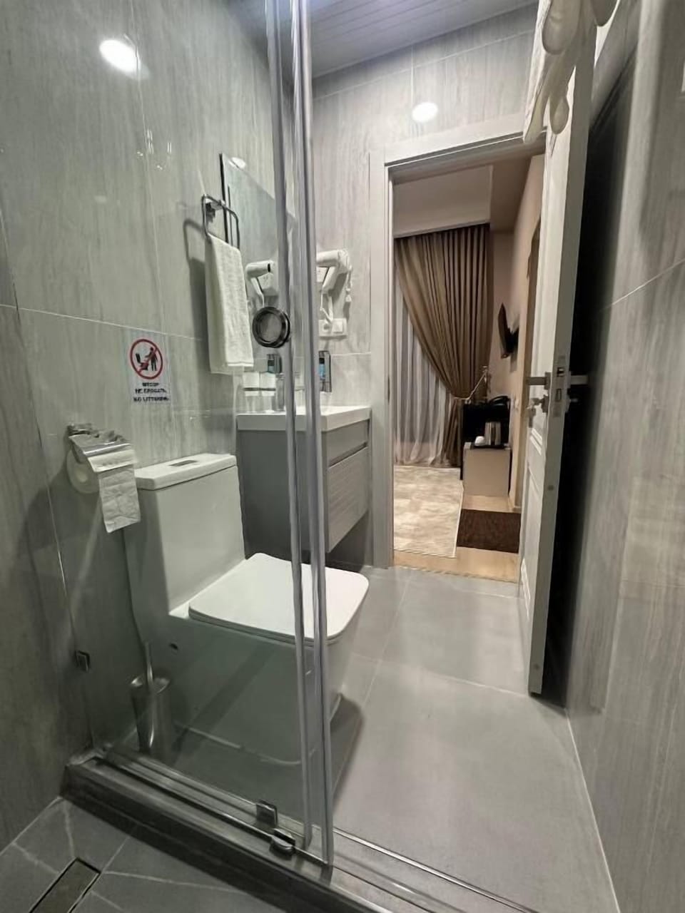 Shower, free toiletries, hair dryer, slippers