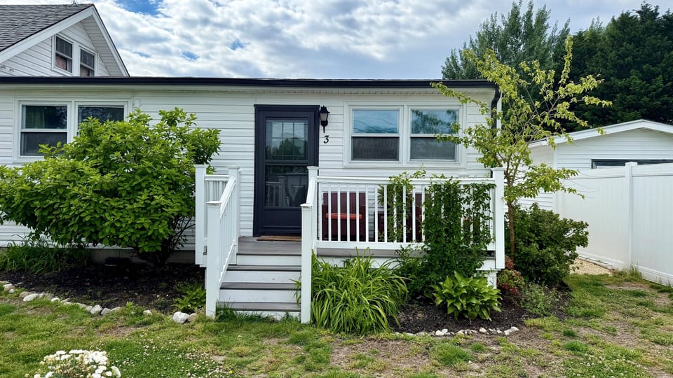 The flat is one of 3 apartments on this property, it occupies a new addition that sits at the back and has its own side and rear yard, along with that sweet front porch.