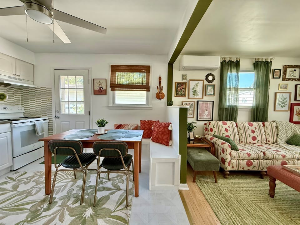 Kitchen and Living room separated by a half wall keeping the space open