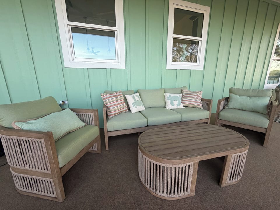 Screened in porch with seating area