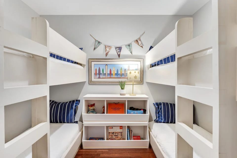 Two twin-over-twin bunk beds offer flexible sleeping space for families and groups.