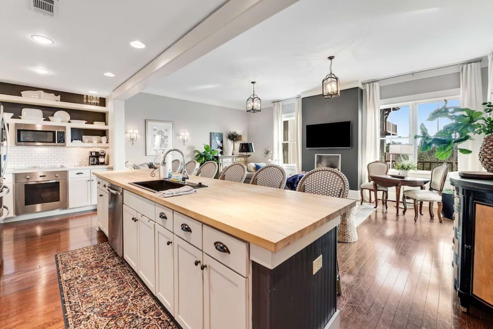 Gather around the oversized island for morning coffee, family meals, and stories from another perfect beach day.