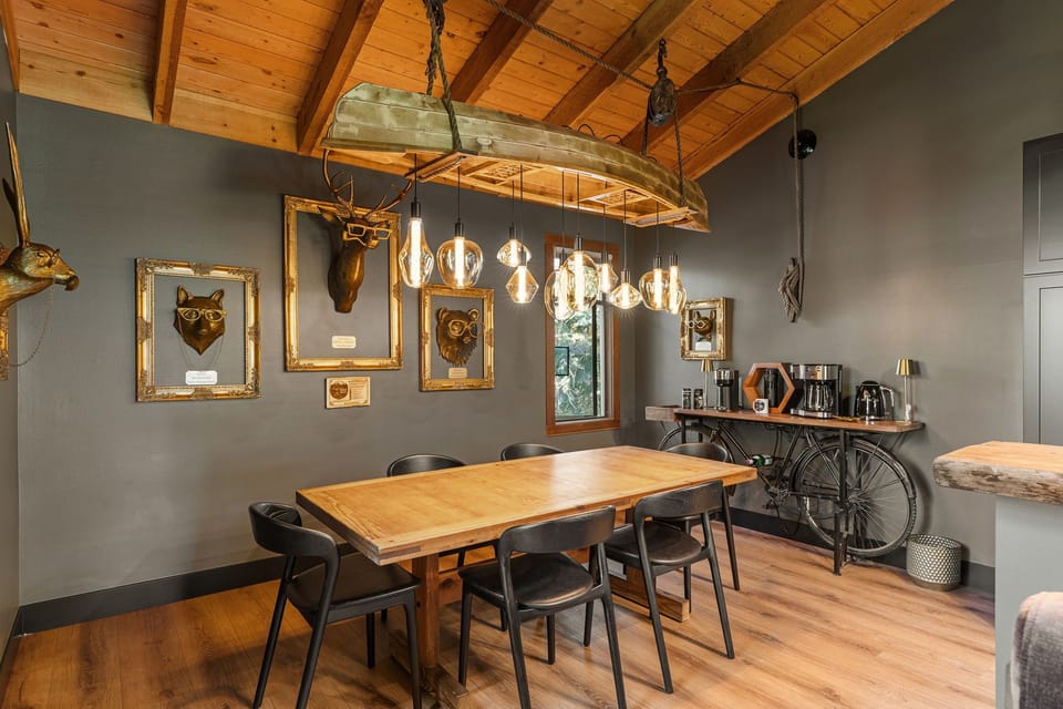 Enjoy meal time around the dining table beneath a handcrafted canoe chandelier, where every meal becomes part of the adventure.