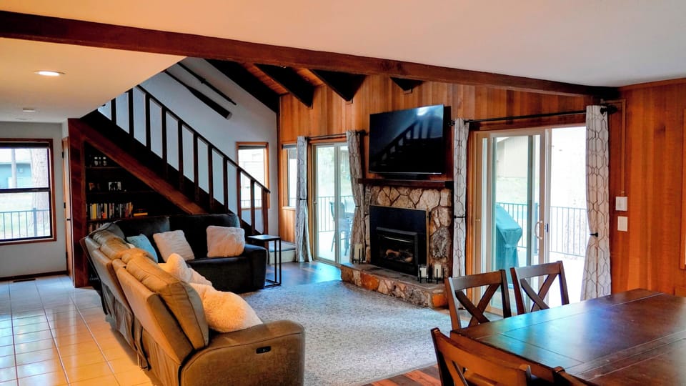Large living room area with TV and fireplace